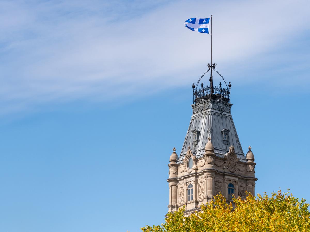 Quebec flag on top of building